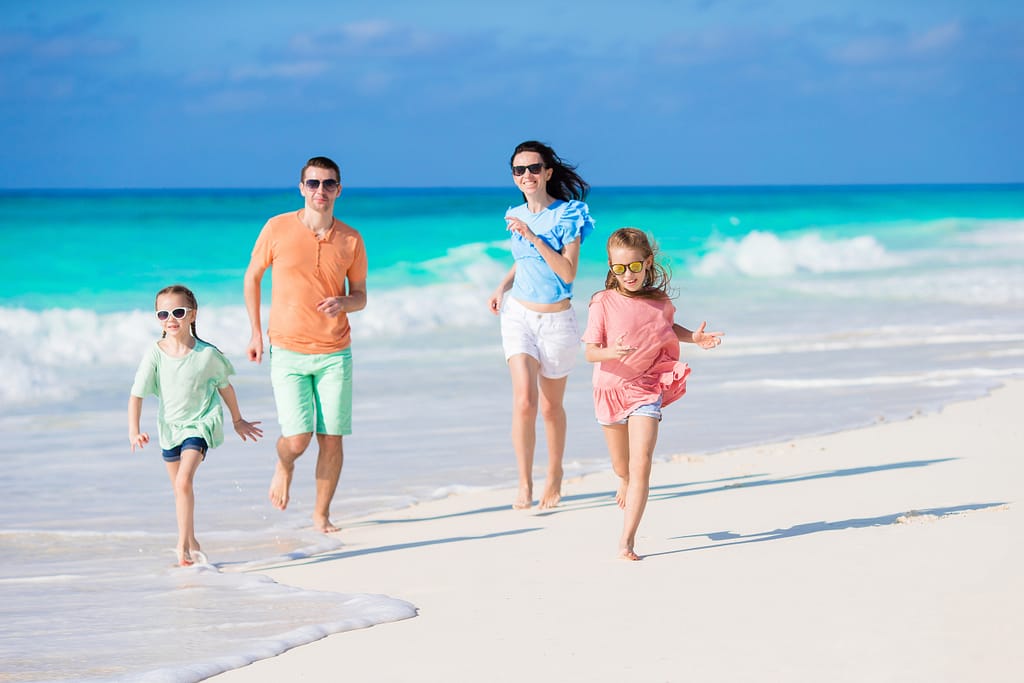 Young family on beach vacation True Southern Accent