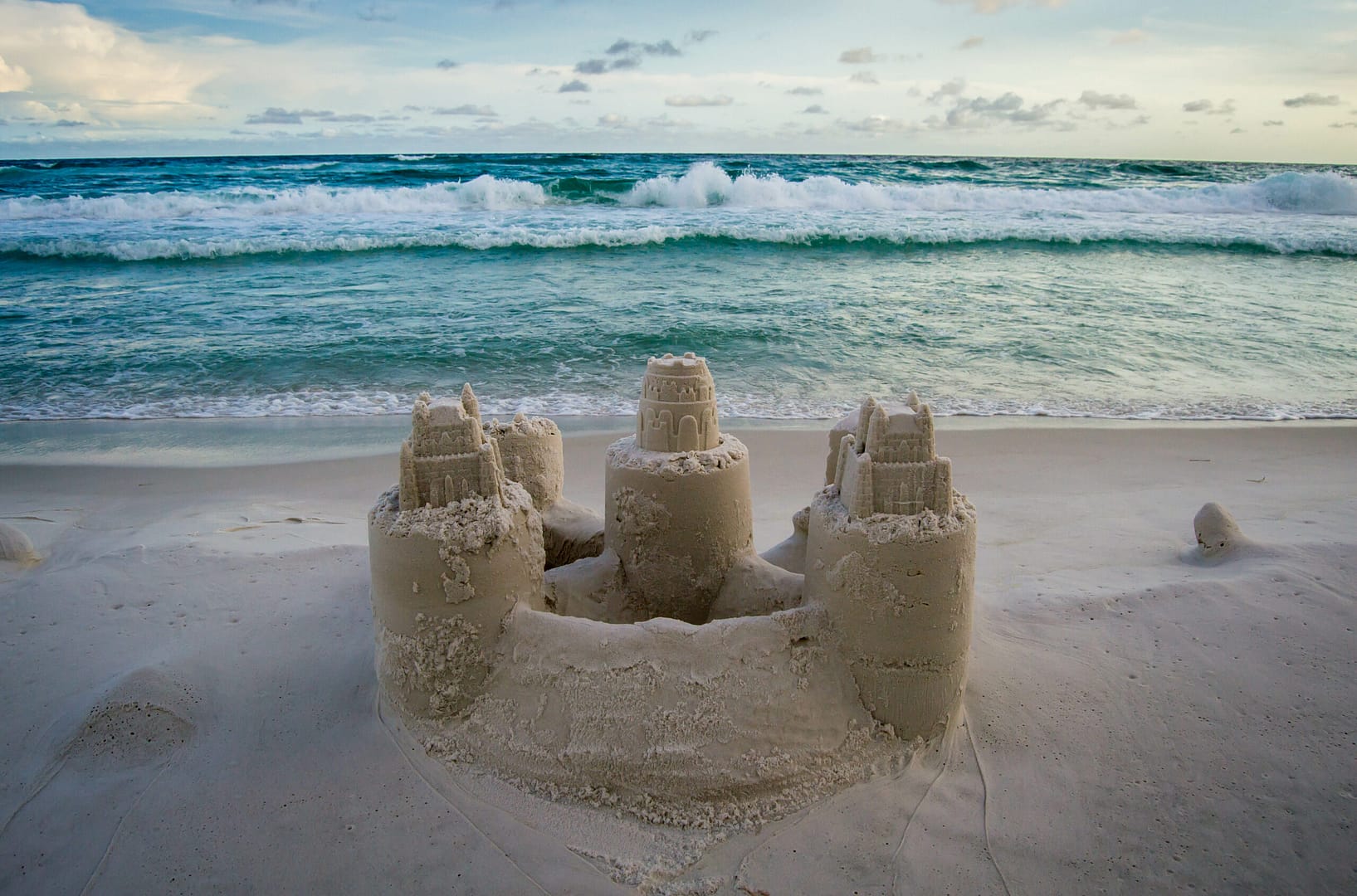 Impressive sand castles with towers on the beach